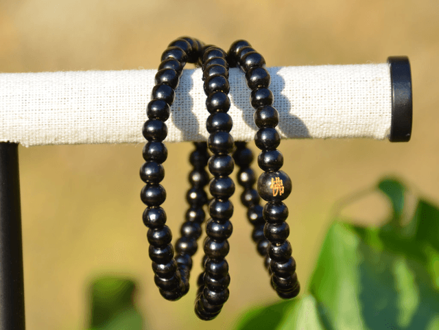 Mala bois imitation bois d'ébène élastique noir